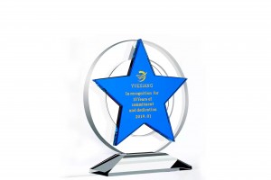 Commemorative crystal glass trophy with disc base and star shape